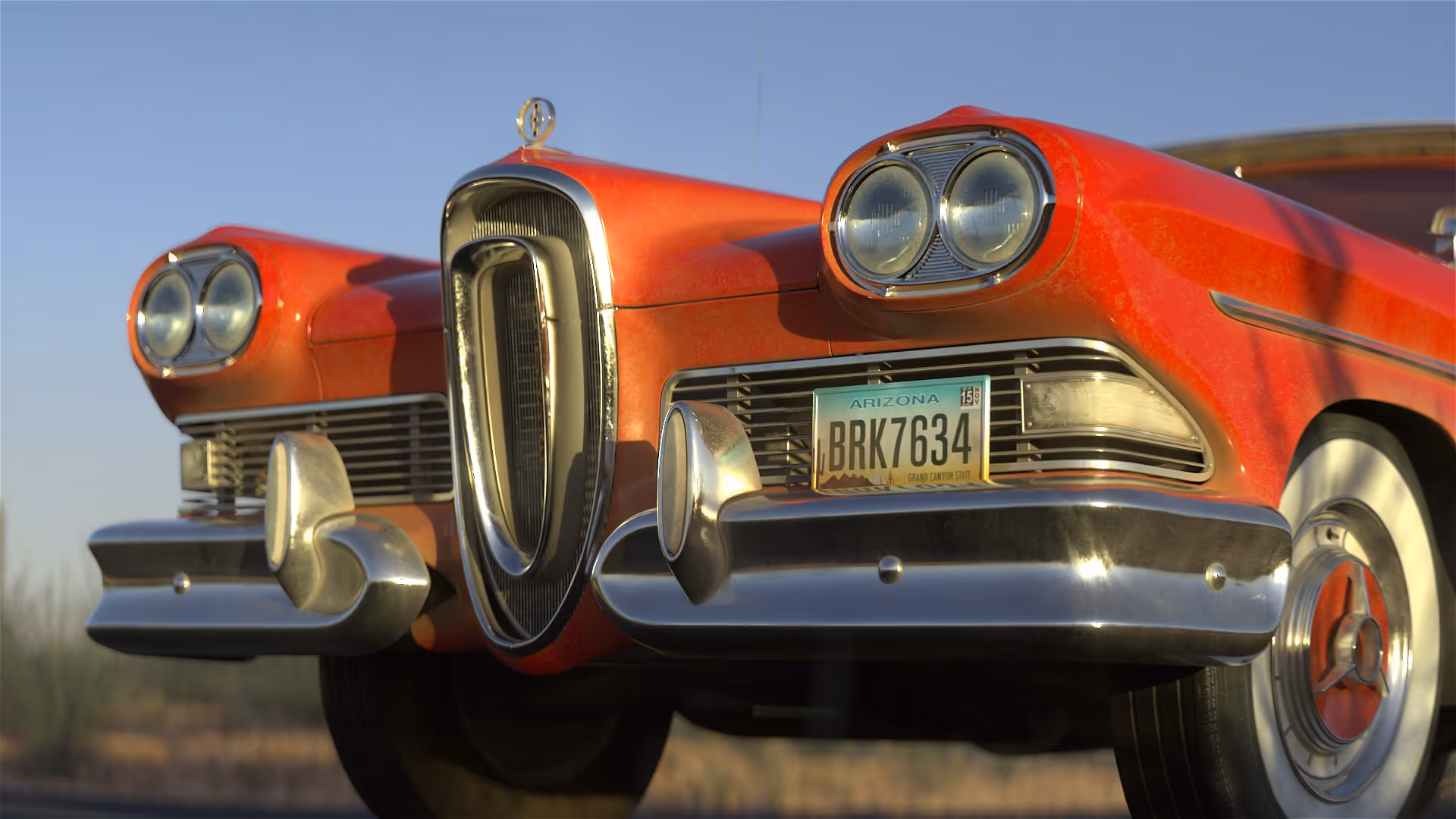 Close-up of red 1958 Edsel Corsair 3D model front grille and headlights, detailed vintage car render with chrome bumper.